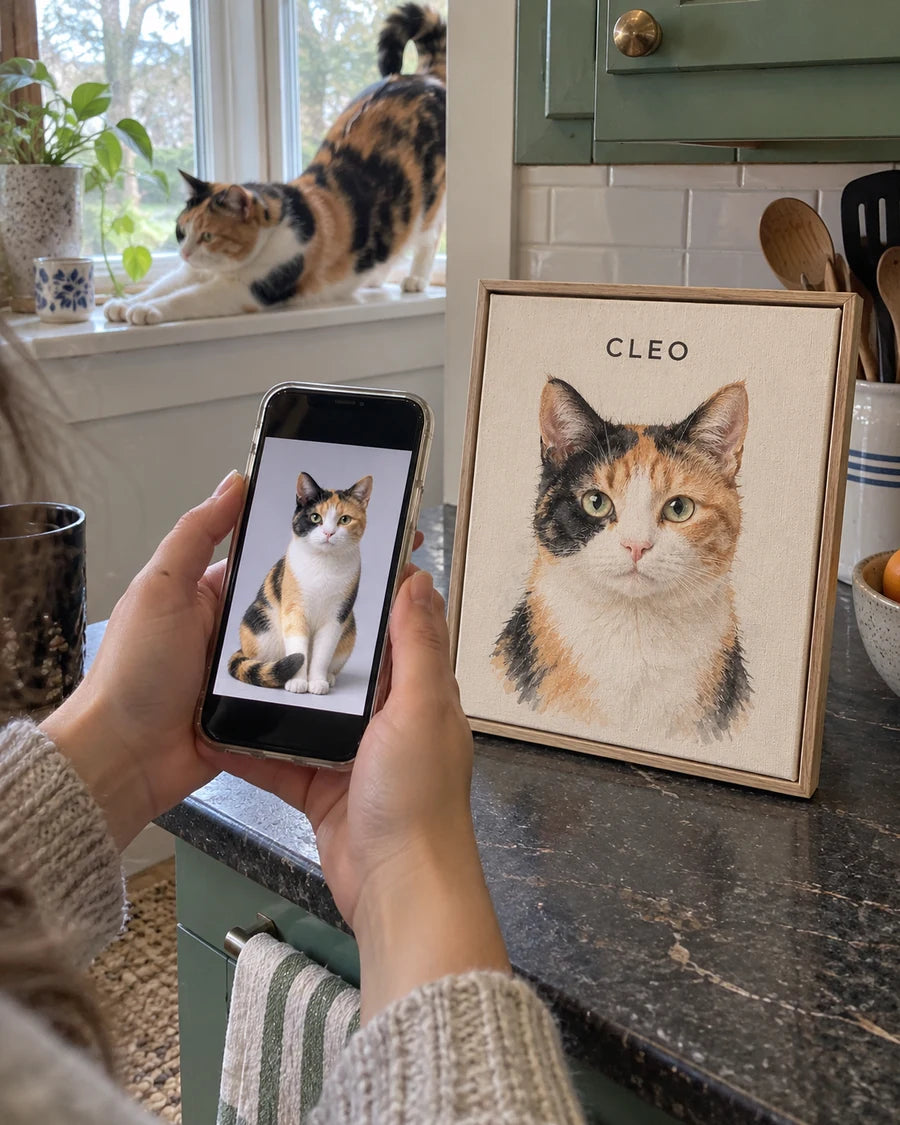 Illustrative scene of Cleo, a calico cat, with a phone photo and framed watercolor portrait.